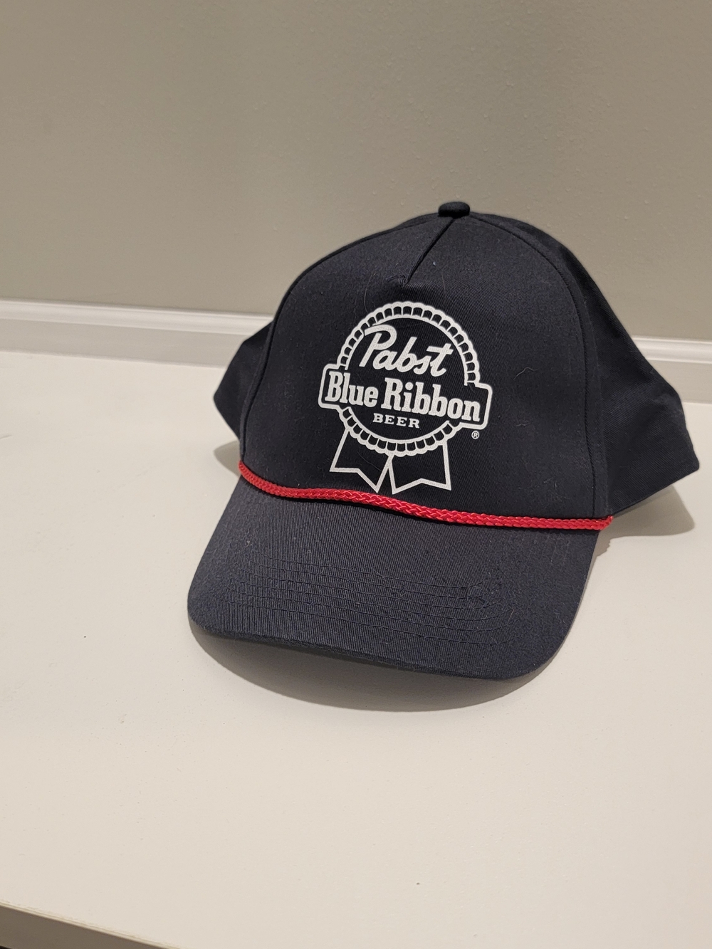 Pabst Blue Ribbon Navy Hat with Red Rope Accent